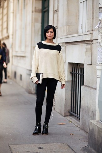Women's White and Black Cable Sweater, Black Skinny Jeans, Black Leather Ankle Boots, Black and White Leather Clutch
