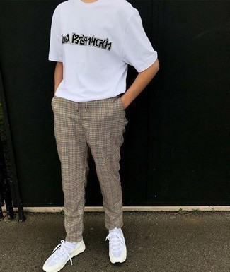 White Athletic Shoes Outfits For Men: This is indisputable proof that a white and black print crew-neck t-shirt and beige plaid chinos are amazing when worn together in a casual outfit. Why not take a more relaxed approach with shoes and add a pair of white athletic shoes to the mix?