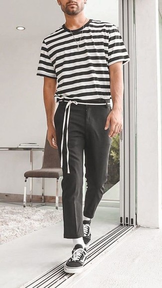 Black Chinos Summer Outfits: For a casual ensemble, marry a white and black horizontal striped crew-neck t-shirt with black chinos — these two pieces fit nicely together. Black and white canvas low top sneakers finish off this ensemble very nicely. This combo isn't a hard one to nail and it's summer-ready, which is more important when it's blazing hot outside.