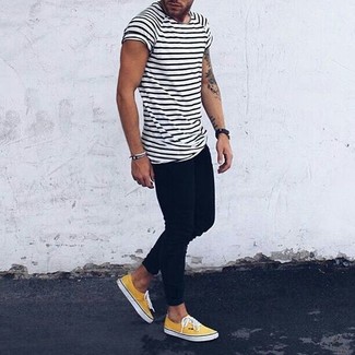 Black Chinos Hot Weather Outfits: Consider wearing a white and black horizontal striped crew-neck t-shirt and black chinos to create a casually cool look. If you want to instantly elevate this outfit with one item, why not add a pair of yellow plimsolls to the equation?