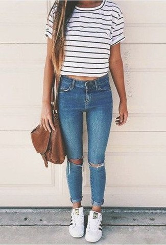 Women's White and Black Horizontal Striped Crew-neck T-shirt, Blue Ripped Skinny Jeans, White and Black Low Top Sneakers, Brown Leather Crossbody Bag