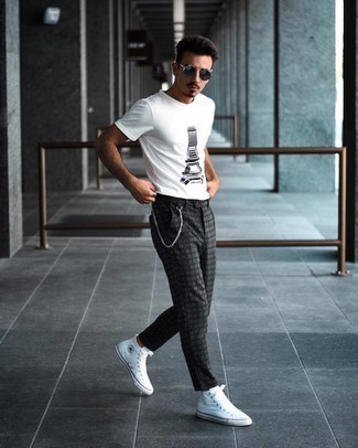Charcoal Plaid Chinos Outfits: This combo of a white and black print crew-neck t-shirt and charcoal plaid chinos resonates versatility and stylish comfort. When it comes to shoes, this ensemble is rounded off brilliantly with white canvas high top sneakers.