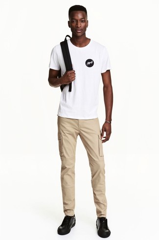 Men's White and Black Print Crew-neck T-shirt, Khaki Chinos, Black Leather Low Top Sneakers, Black Backpack
