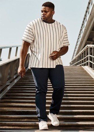 White Vertical Striped Crew-neck T-shirt Outfits For Men: Such essentials as a white vertical striped crew-neck t-shirt and navy chinos are the perfect way to introduce some cool into your current casual collection. Add white leather low top sneakers to the mix and off you go looking amazing.