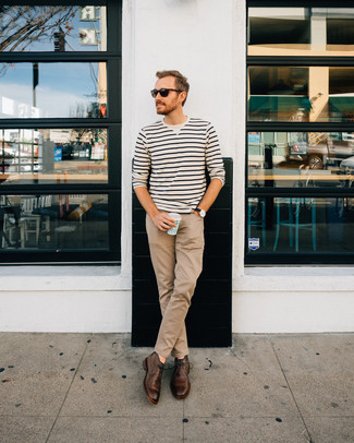 White and Black Horizontal Striped Crew-neck Sweater Outfits For Men: Pair a white and black horizontal striped crew-neck sweater with khaki chinos for a laid-back kind of elegance. A nice pair of dark brown leather desert boots is an effortless way to transform your ensemble.