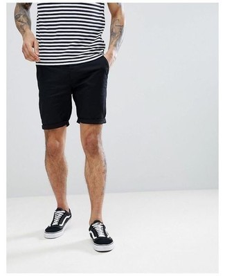 Black Shorts Outfits For Men: A white and black horizontal striped crew-neck t-shirt and black shorts are essential menswear items, without which no off-duty wardrobe would be complete. Complement this look with black and white canvas low top sneakers and ta-da: the ensemble is complete.