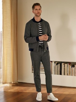 White and Navy Horizontal Striped Crew-neck T-shirt Outfits For Men: The combination of a white and navy horizontal striped crew-neck t-shirt and a charcoal track suit makes this a solid off-duty look. Amp up this whole outfit by wearing a pair of white canvas low top sneakers.