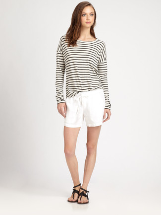 Black Thong Sandals Outfits: Why not dress in a white and black horizontal striped long sleeve t-shirt and white shorts? Both of these items are super comfy and will look stunning when combined together. Complement your outfit with a pair of black thong sandals to effortlessly bump up the cool of this look.