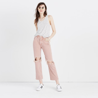 Pink Boyfriend Jeans Outfits: If the setting permits an off-duty ensemble, go for a white and black horizontal striped tank and pink boyfriend jeans. Let's make a bit more effort now and complement this look with a pair of white and black horizontal striped low top sneakers.