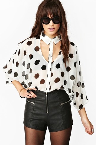 White and Black Long Sleeve Blouse Outfits: This laid-back combination of a white and black long sleeve blouse and black leather shorts is a never-failing option when you need to look good but have no time.