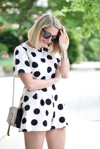 1200+ Hot Weather Outfits For Women: A white and black polka dot playsuit will add serious style to your off-duty styling lineup.