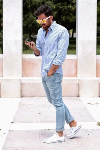 Men's White and Blue Vertical Striped Dress Shirt, Light Blue Skinny Jeans, White Low Top Sneakers, Yellow Sunglasses