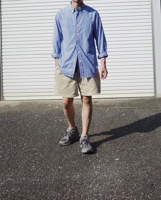 Beige Shorts Outfits For Men: This relaxed casual combo of a white and blue vertical striped long sleeve shirt and beige shorts comes to rescue when you need to look great in a flash. For something more on the casually cool end to round off your look, complete this ensemble with grey athletic shoes.