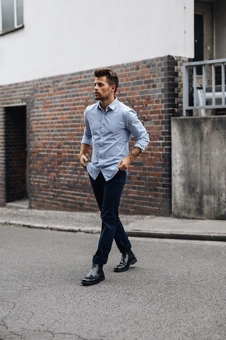 White and Blue Long Sleeve Shirt Outfits For Men: You're looking at the irrefutable proof that a white and blue long sleeve shirt and navy chinos look awesome when married together in a casual outfit. Take this ensemble down a more sophisticated path by rounding off with black leather chelsea boots.