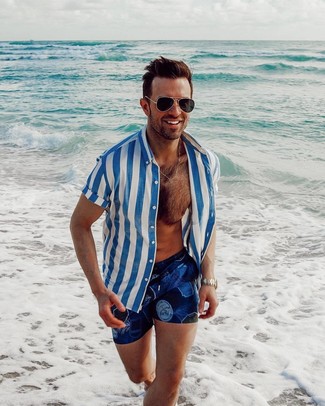 Navy and White Print Swim Shorts Relaxed Outfits: A white and blue vertical striped short sleeve shirt and navy and white print swim shorts are awesome menswear must-haves to have in your casual arsenal.
