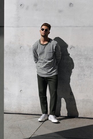 Grey Canvas High Top Sneakers Outfits For Men: For a cool and casual outfit, consider wearing a white and green horizontal striped long sleeve t-shirt and dark green chinos — these two items fit perfectly well together. When this outfit appears too classic, play it down by finishing with a pair of grey canvas high top sneakers.