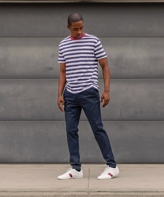 Black Socks Summer Outfits For Men: Who said you can't make a style statement with an edgy look? You can do so with ease in a white and navy horizontal striped crew-neck t-shirt and black socks. To bring out a classy side of you, complement this ensemble with a pair of white print leather low top sneakers. This outfit is a tested option if you're searching for a great, summer-appropriate outfit.