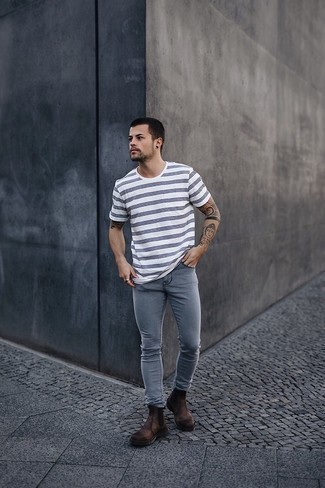 Grey Skinny Jeans Outfits For Men: This relaxed combination of a white and navy horizontal striped crew-neck t-shirt and grey skinny jeans is very easy to throw together without a second thought, helping you look awesome and ready for anything without spending a ton of time going through your wardrobe. Hesitant about how to complement this ensemble? Finish with dark brown leather chelsea boots to dress it up.