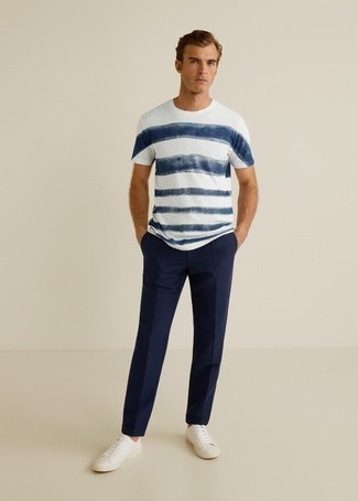 White and Navy Horizontal Striped Crew-neck T-shirt Outfits For Men: A white and navy horizontal striped crew-neck t-shirt and navy chinos paired together are a perfect match. For extra style points, add a pair of white canvas low top sneakers to the equation.