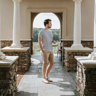 White and Black Horizontal Striped Crew-neck T-shirt Outfits For Men: This combination of a white and black horizontal striped crew-neck t-shirt and tan shorts is uber stylish and provides a neat and relaxed look. White and black canvas low top sneakers look perfect here.