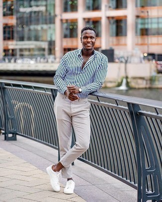 White Vertical Striped Long Sleeve Shirt Outfits For Men: A white vertical striped long sleeve shirt and beige chinos are a good combo worth incorporating into your daily off-duty arsenal. The whole ensemble comes together perfectly if you go for a pair of white canvas low top sneakers.