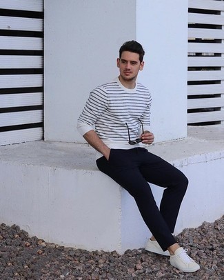 Men's White and Navy Horizontal Striped Long Sleeve T-Shirt, Navy Chinos, Beige Canvas Low Top Sneakers, Black Sunglasses