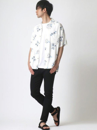 White and Black Print Short Sleeve Shirt Outfits For Men: A white and black print short sleeve shirt looks especially nice when married with black skinny jeans in a casual outfit. For something more on the daring side to round off your ensemble, introduce a pair of black canvas sandals to the mix.