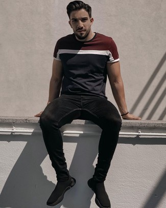 Black Skinny Jeans Outfits For Men: Look dapper yet functional by wearing a white and red and navy crew-neck t-shirt and black skinny jeans. On the shoe front, this getup pairs really well with black athletic shoes.