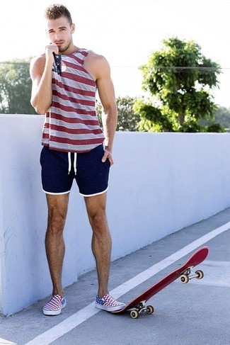 Multi colored Tank Outfits For Men: This relaxed combo of a multi colored tank and navy shorts is a foolproof option when you need to look cool in a flash. As for the shoes, stick to a classier route with a pair of white and red and navy slip-on sneakers.