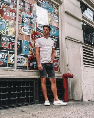 Black Shorts Outfits For Men: This combination of a white and red horizontal striped crew-neck t-shirt and black shorts will prove your prowess in men's fashion even on lazy days. For maximum style, introduce white canvas low top sneakers to this look.