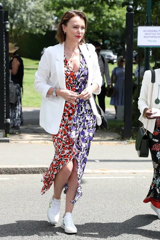 Women's Outfits 2021: A white blazer and a multi colored floral maxi dress are a cool getup to add to your current casual wardrobe. For something more on the daring side to finish this ensemble, introduce a pair of white low top sneakers to this look.