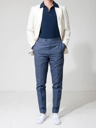 White Blazer Outfits For Men: A white blazer and blue dress pants are a seriously sharp outfit to try. To infuse a more casual aesthetic into this look, complement your ensemble with white canvas low top sneakers.