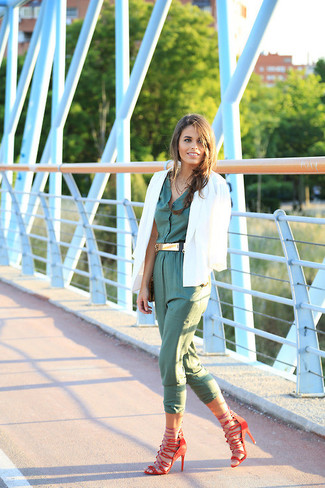 Red Leather Flat Sandals Outfits: Try teaming a white blazer with an olive jumpsuit for a fuss-free look that's also pulled together nicely. Why not complement this ensemble with a pair of red leather flat sandals for a more relaxed spin?