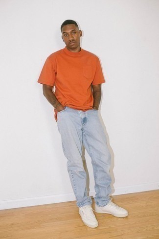 Men's White Canvas Low Top Sneakers, Light Blue Jeans, Orange Crew-neck T-shirt