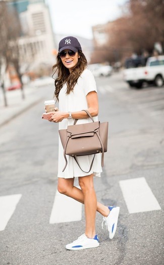 White Casual Dress Outfits: Rock a white casual dress to assemble a laid-back yet stylish outfit. A pair of white low top sneakers is a goofproof footwear style here that's also full of personality.