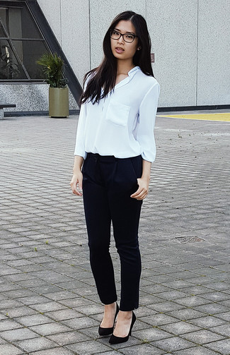 Navy Tapered Pants Outfits For Women: A white chiffon button down blouse and navy tapered pants are an easy way to infuse some elegance into your current off-duty rotation. A pair of black suede pumps is a nice option to round off your ensemble.