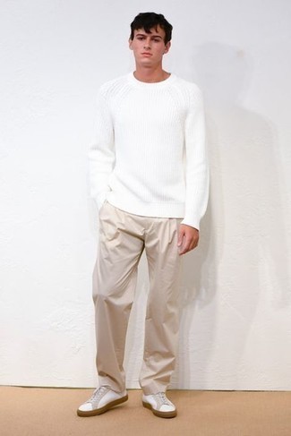 White Crew-neck Sweater with Beige Chinos Outfits: A white crew-neck sweater and beige chinos are the kind of a tested off-duty ensemble that you need when you have zero time to dress up. Have some fun with things and introduce white canvas low top sneakers to your look.