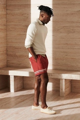 White Crew-neck Sweater Warm Weather Outfits For Men: For a laid-back menswear style with a clear fashion twist, choose a white crew-neck sweater and red shorts. Let your styling credentials truly shine by completing this outfit with white canvas low top sneakers.