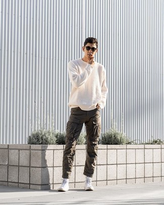 Brown Cargo Pants Outfits: For a relaxed casual ensemble, team a white crew-neck sweater with brown cargo pants — these items play brilliantly together. To give your overall ensemble a more relaxed feel, why not complement this look with white canvas high top sneakers?