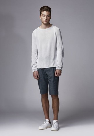 Charcoal Shorts Outfits For Men: This casual pairing of a white crew-neck sweater and charcoal shorts is very easy to throw together without a second thought, helping you look awesome and prepared for anything without spending a ton of time digging through your closet. White leather low top sneakers integrate smoothly within a ton of combinations.