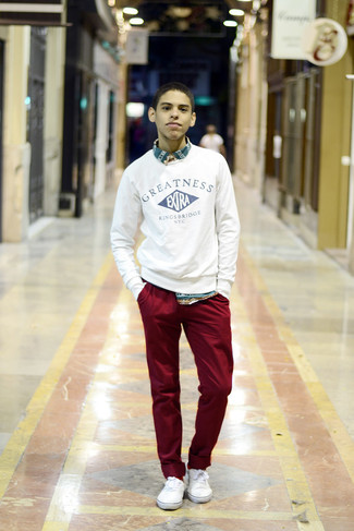 White and Navy Print Crew-neck Sweater Outfits For Men: For a relaxed getup, dress in a white and navy print crew-neck sweater and burgundy chinos — these two pieces fit beautifully together. This look is complemented wonderfully with a pair of white low top sneakers.