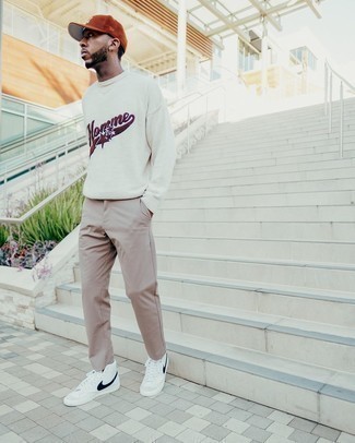 Crew-neck Sweater Outfits For Men: This pairing of a crew-neck sweater and khaki chinos looks awesome and immediately makes any gent look cool. Add a pair of white and black canvas high top sneakers to the mix to make an all-too-safe getup feel suddenly fresh.