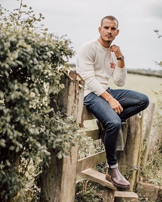 White and Navy Print Crew-neck Sweater Outfits For Men: A white and navy print crew-neck sweater and navy skinny jeans make for the ultimate relaxed style for any gentleman. Step up your getup by slipping into brown leather chelsea boots.