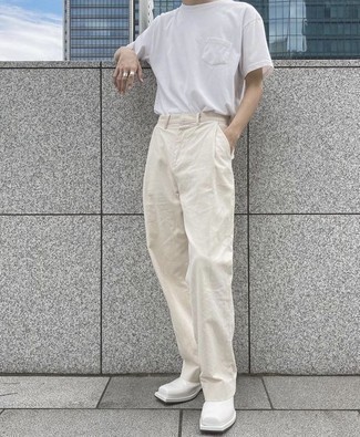 Beige Chinos Outfits: Pair a white crew-neck t-shirt with beige chinos for a daily look that's full of style and personality. Rev up this ensemble by sporting white leather chelsea boots.