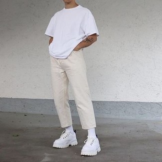 White Sneakers with Beige Jeans Casual Summer Outfits For Men: You'll be amazed at how easy it is for any gent to get dressed this way. Just a white crew-neck t-shirt and beige jeans. And if you need to instantly play down this ensemble with one item, complement this ensemble with a pair of white sneakers. Come blazing hot summer days you're looking for an ensemble to keep you cool and seriously stylish –– this getup is ideal for this time.