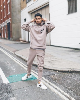 Beige Track Suit Outfits For Men: Teaming a beige track suit with a white crew-neck t-shirt is an awesome pick for a laid-back yet on-trend getup. Finishing with a pair of white print canvas low top sneakers is a surefire way to introduce some extra classiness to your look.