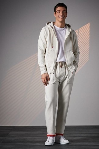 Men's Outfits 2022: Who said you can't make a stylish statement with an urban ensemble? That's easy in a white crew-neck t-shirt and a beige track suit. And if you need to immediately lift up this look with footwear, why not introduce a pair of white leather low top sneakers to the equation?