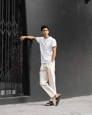 Black Leather Sandals Outfits For Men: A white crew-neck t-shirt looks especially great when matched with beige vertical striped chinos. Let your styling credentials really shine by rounding off your look with a pair of black leather sandals.