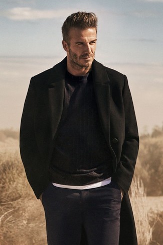 David Beckham wearing Navy Dress Pants, White Crew-neck T-shirt, Black Crew-neck Sweater, Black Overcoat
