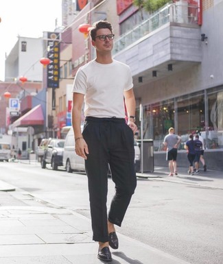 Black Linen Chinos Outfits: This on-trend ensemble is really pared down: a white crew-neck t-shirt and black linen chinos. Black leather loafers will add a different twist to this outfit.
